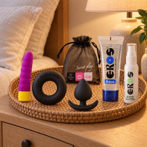 Basic sex toy kit with bullet, cock ring, plug and dice – lifestyle scene (AI-generated image)